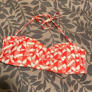 Red and white bathing suit top. Removable string straps. Metal clasp